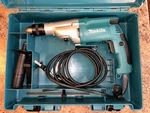 Makita 2-SPEED Hammer Drill With Case, Model HP2050, Mpn. Fixed Price $100.00.