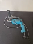 Makita 5/8" Corded Hammer Drill Model HP1640 With Handle. Fixed Price $38.00.