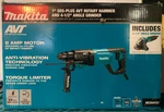 Makita HR2641X1 1" Rotary Hammer Angle Grinder Set. Fixed Price $199.99.