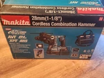 Makita GRH01M1 40V Hammer Drill W/ 4AH Battery, Charger, And Bag. Fixed Price $469.00.