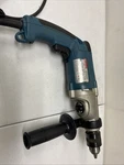 Makita Electric Hammer Drill HP2050F. Fixed Price $65.00.